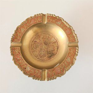 Vintage etched brass ashtray with red inlay.